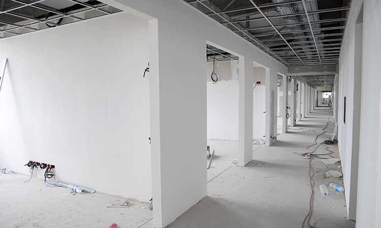 Drylining of interior partition walls