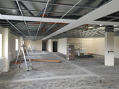 Office with a suspended ceiling being fitted